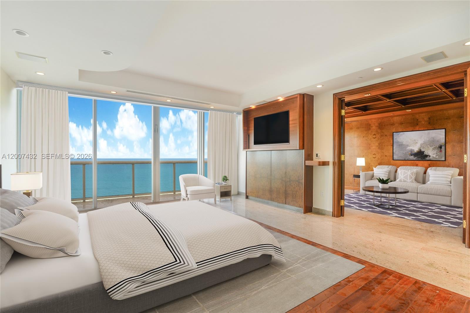 A bedroom with a view of the ocean, a television unit, and an adjacent sitting room — 9601 Collins Ave # T4, Bal Harbour FL 33154, BAL HARBOUR, FL