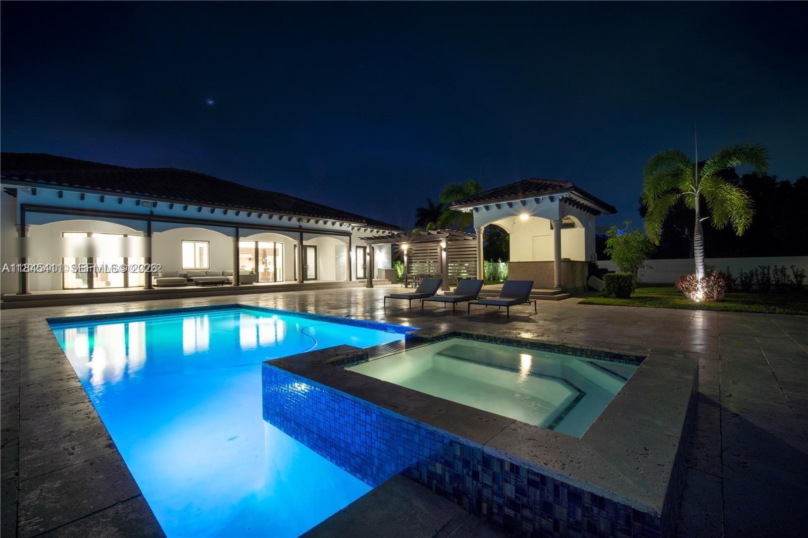 A backyard features a swimming pool, a covered patio area, and surrounding palm trees — 331 SW 124th Ave, Miami FL 33184, MIAMI, FL