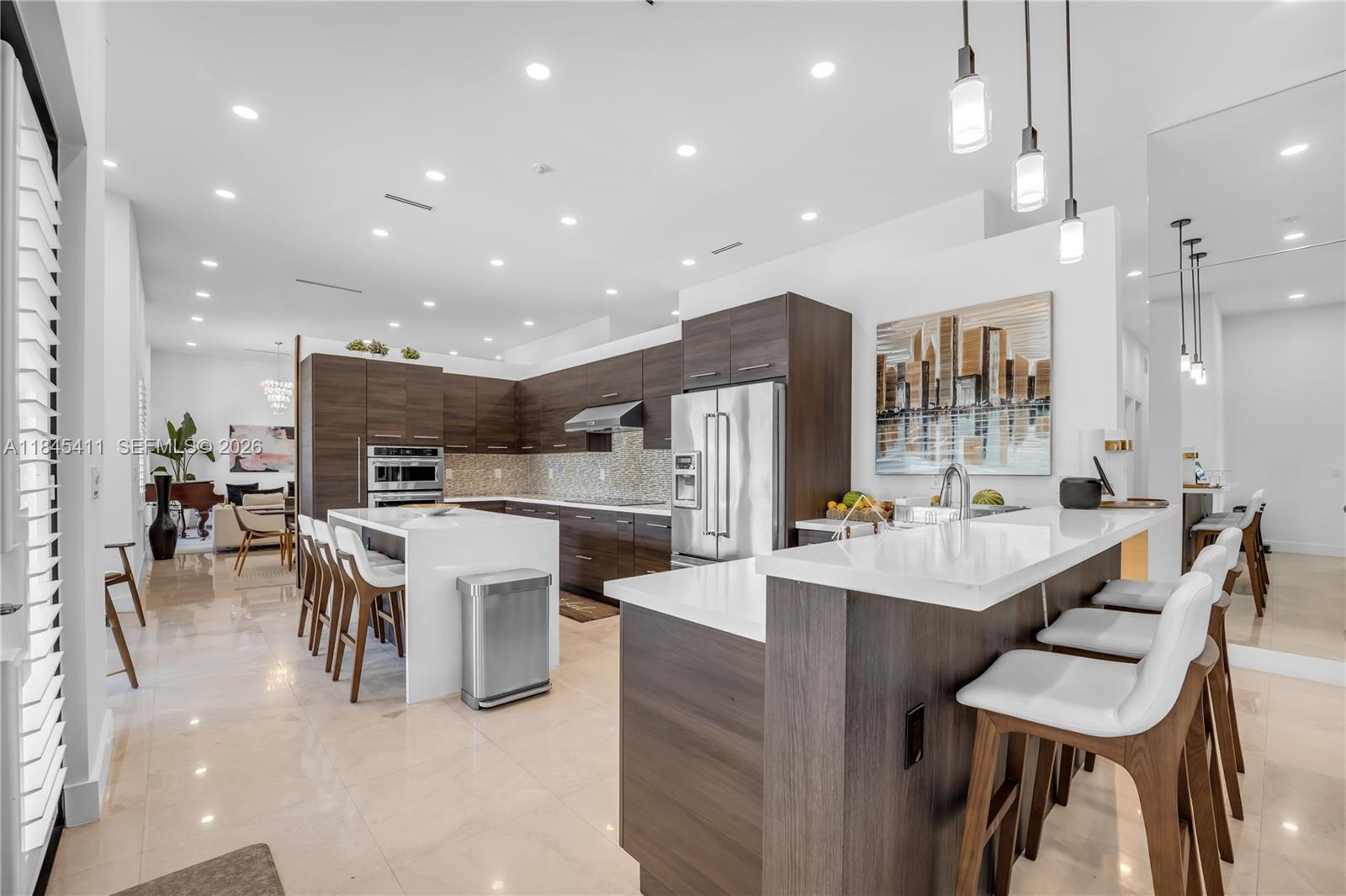 A backyard features a swimming pool, patio, palm trees, and a house with a tiled roof — 331 SW 124th Ave, Miami FL 33184, MIAMI, FL