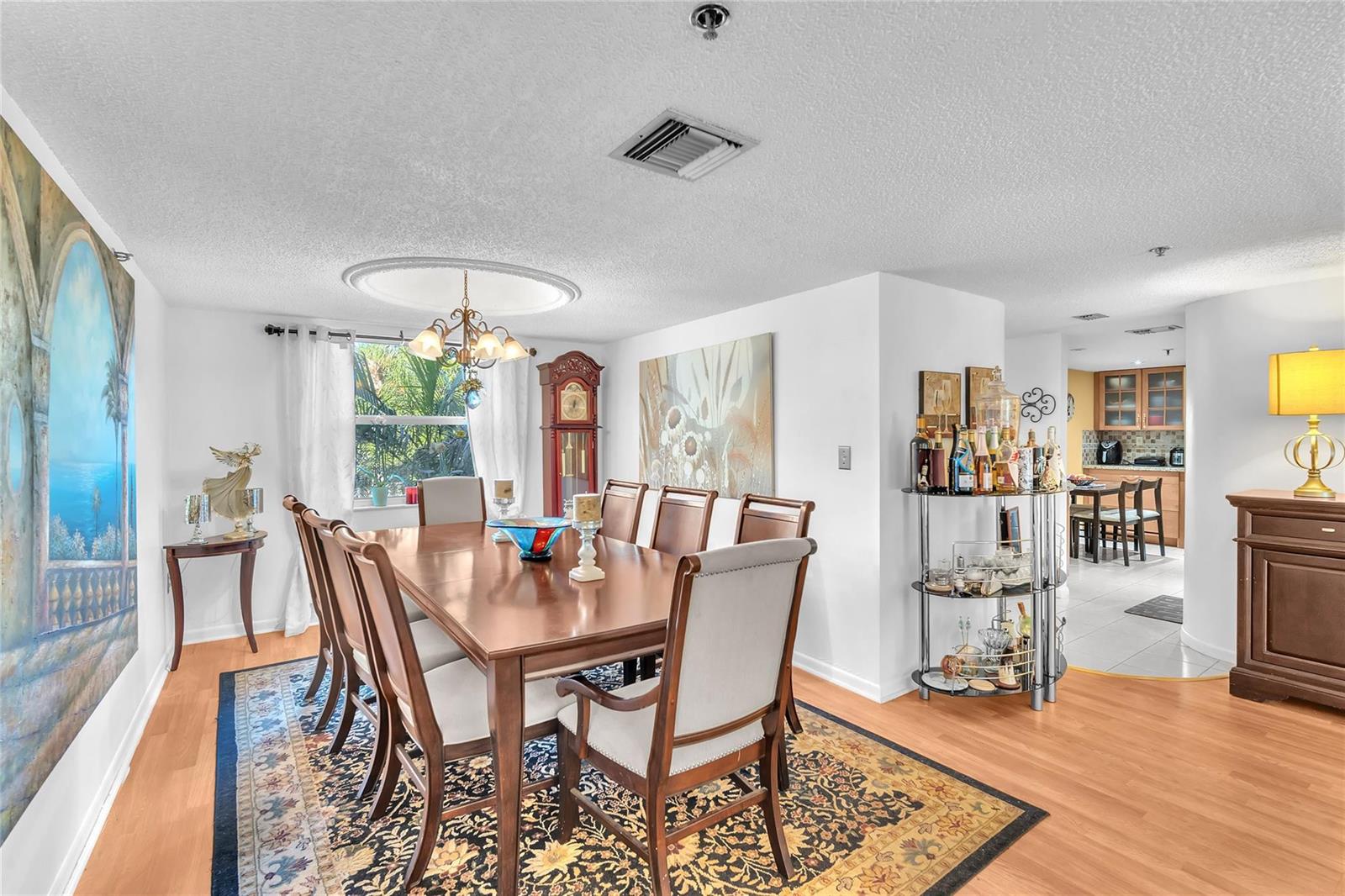 An aerial view shows a multi-story apartment building with a parking lot and surrounding greenery — 3910 Inverrary Boulevard # B, Lauderhill FL 33319, LAUDERHILL, FL