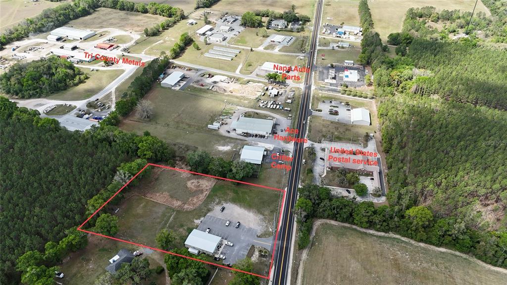 This aerial view shows a commercial property outlined in red along a rural road — 535 SE STATE ROAD 26, TRENTON, FL