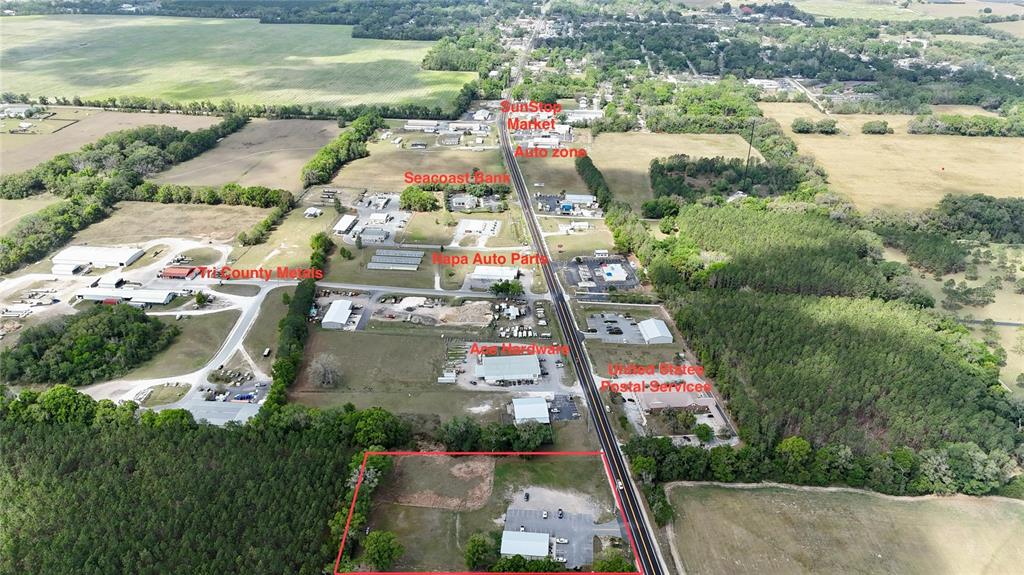 This aerial view shows a commercial property outlined in red along a rural highway — 535 SE STATE ROAD 26, TRENTON, FL