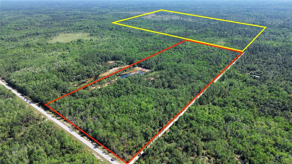 An aerial view shows two adjacent wooded land parcels outlined in red and yellow — Tract 102 SW CR-347, CHIEFLAND, FL