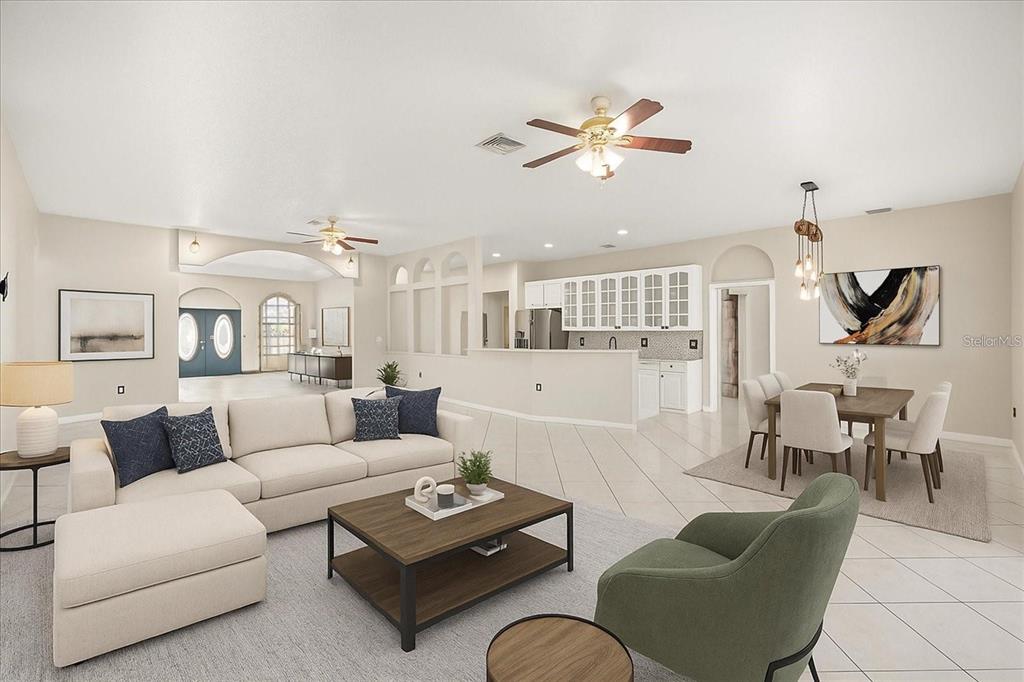 This open-concept living and dining area features tile flooring, neutral walls, and a kitchen — 13848 VISTA DEL LAGO BOULEVARD, CLERMONT, FL
