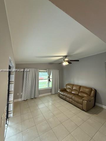 A living room features light tile flooring, a tan leather sofa, and a ceiling fan — 4100 SW 36th St, West Park FL 33023, WEST PARK, FL