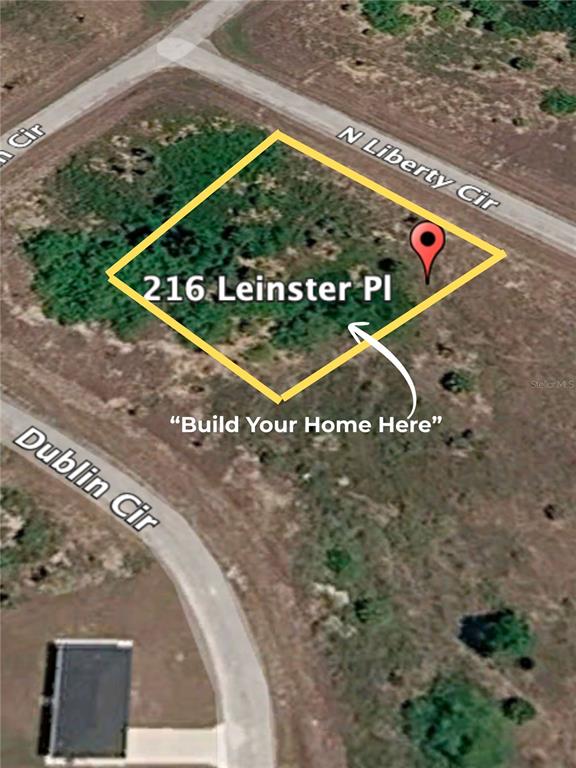 A paved road leads to an expansive, grassy field under a bright, sunny sky — 216 LEINSTER PLACE, LABELLE, FL