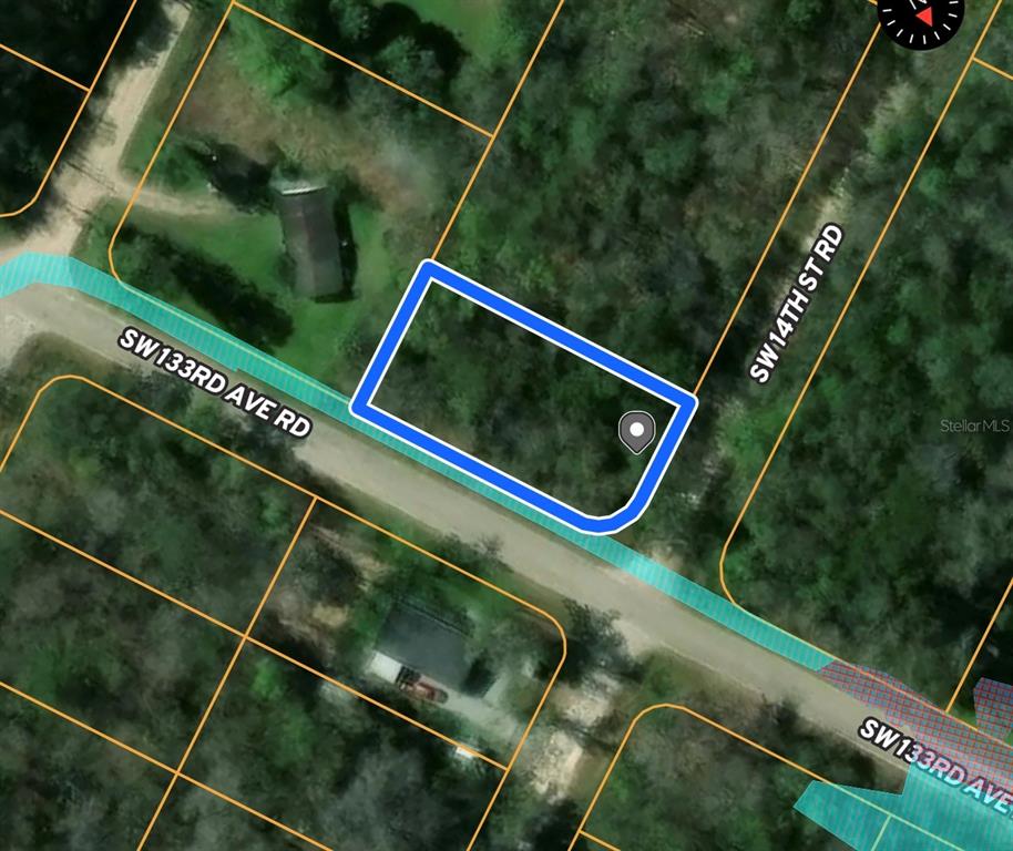 This is a satellite map view showing a vacant rectangular lot at a road intersection — 13320 SW 14TH STREET ROAD, OCALA, FL