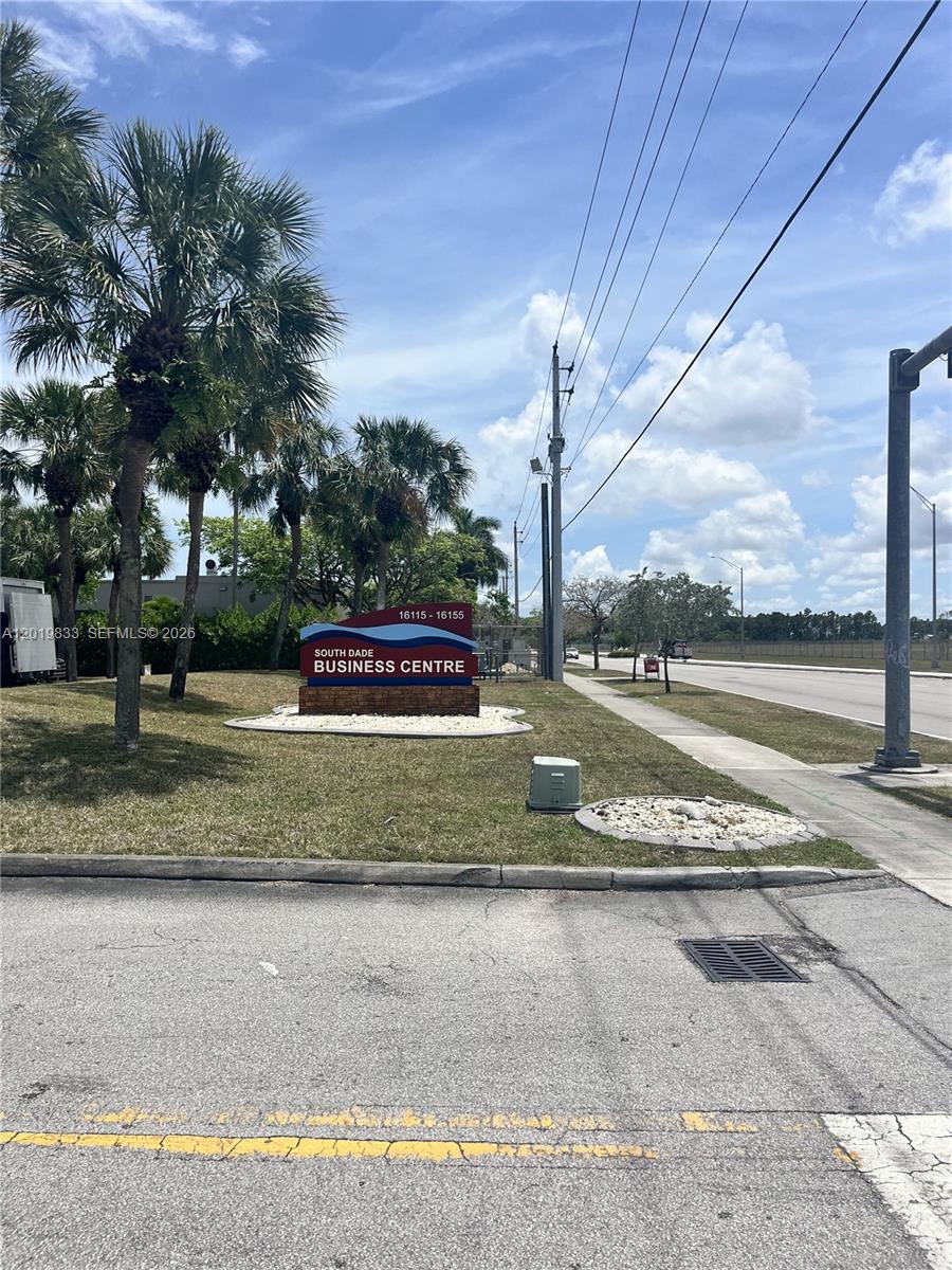 A sign for the South Dade Business Centre stands on a grassy lot with palm trees — 16115 SW 117th Ave # A13, Miami FL 33177, MIAMI, FL