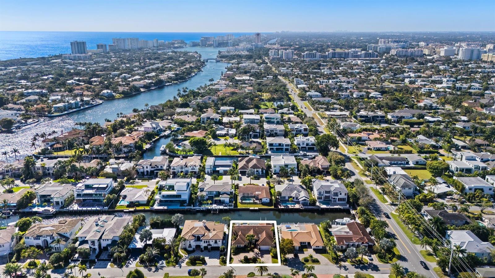 An aerial view shows a residential neighborhood with a highlighted house along a canal — 520 Phillips Drive, Boca Raton FL 33432, BOCA RATON, FL
