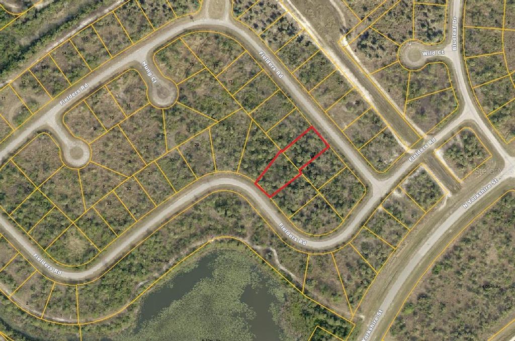 An aerial map shows a vacant residential lot outlined in red along a curved road — 2333 FIELDERS (LOT 21 & 26) ROAD, NORTH PORT, FL