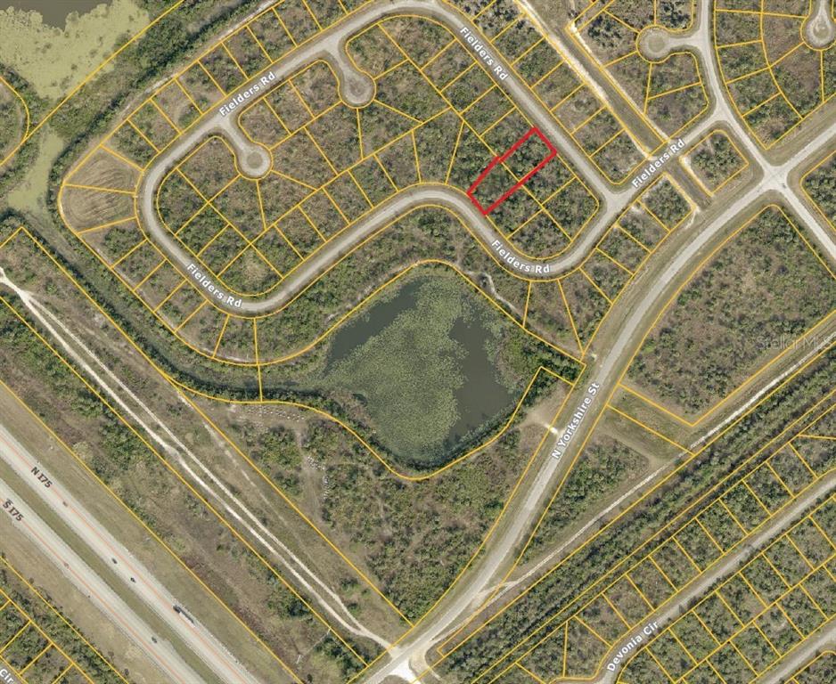 This is an aerial map showing a vacant residential lot highlighted in red on Fielders Road — 2333 FIELDERS (LOT 21 & 26) ROAD, NORTH PORT, FL