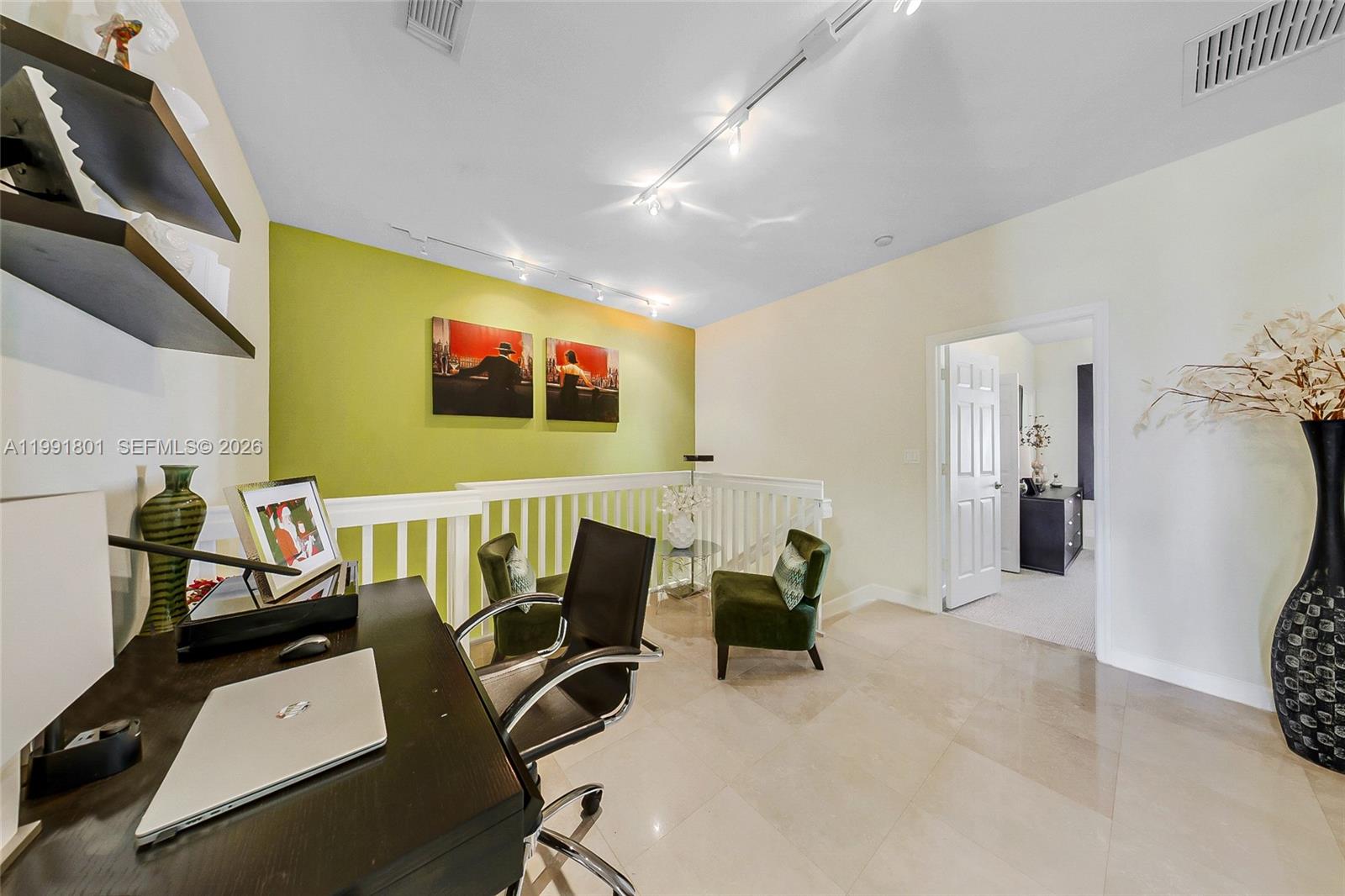 A home office area features a desk, two green chairs, and a lime green wall — 10711 NW 75th Ln, Doral FL 33178, DORAL, FL
