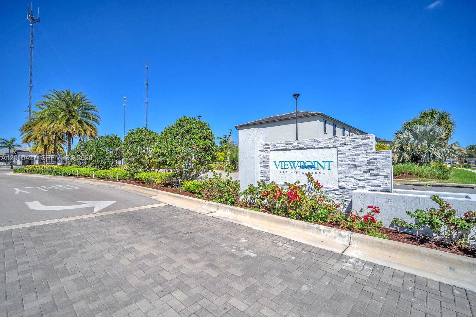 A stone monument sign for Viewpoint at Vista Lago stands at a paved entrance — 20308 NW 6th Pl, Miami Gardens FL 33169, MIAMI GARDENS, FL
