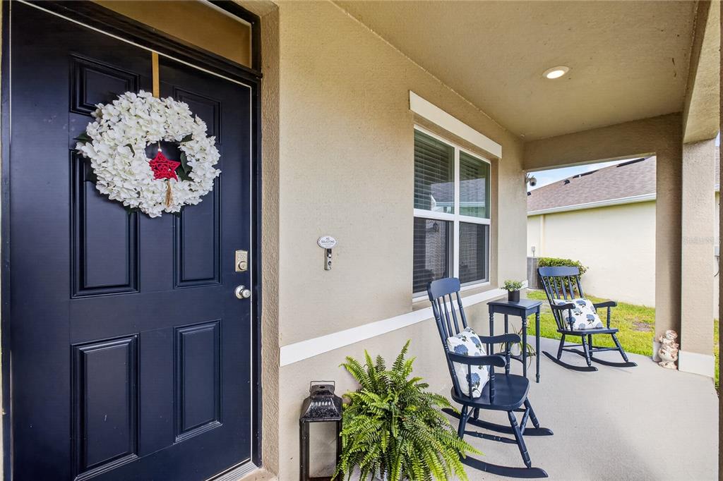 A view from an entryway into a home with a console table and dining area — 3995 MEKONG COURT, ST CLOUD, FL