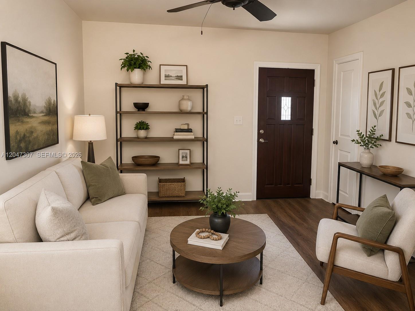 A living room features a beige sofa, a round coffee table, and a dark wood door — 790 E 6th Pl, Hialeah FL 33010, HIALEAH, FL