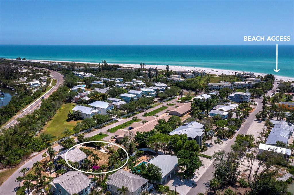 An aerial view shows a coastal neighborhood with a circled property near the beach — 450 FIREHOUSE COURT, LONGBOAT KEY, FL