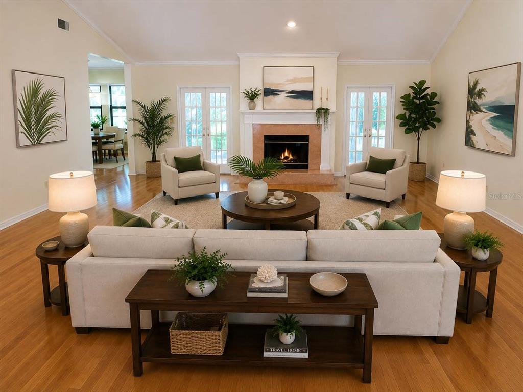 A living room features a fireplace, beige sofa, two armchairs, and hardwood floors — 6124 SW 35TH WAY, GAINESVILLE, FL
