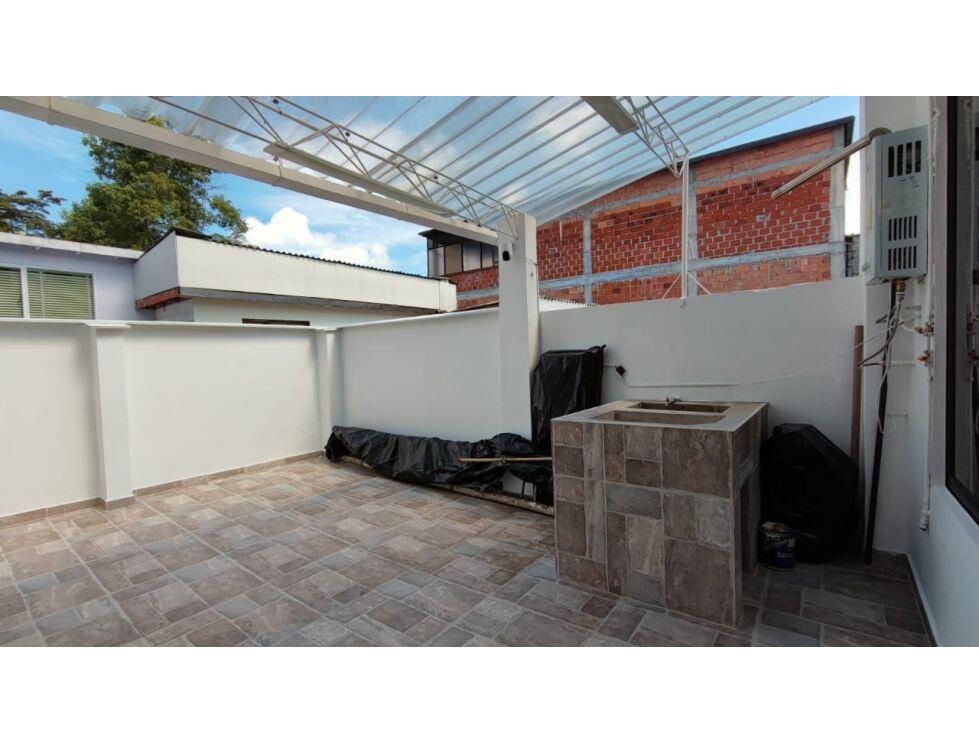 A tiled outdoor patio features a covered roof, white walls, and a stone-tiled barbecue grill — 8-77 Carrera 8va. Barrio Chipre # 77, FL