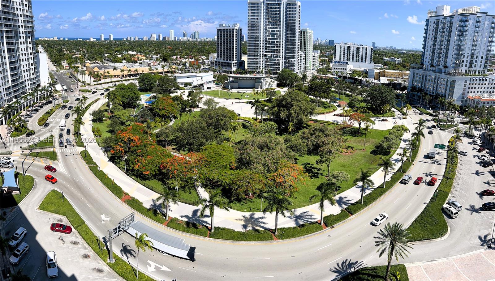 An aerial view shows a large urban park surrounded by high-rise buildings and roads — 1830 Radius Dr # 1203, Hollywood FL 33020, HOLLYWOOD, FL