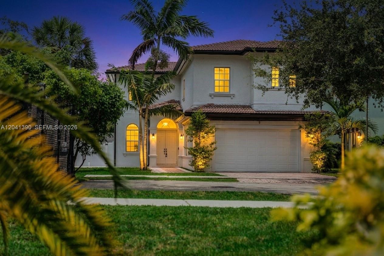 A two-story stucco house with a tile roof, a two-car garage, and palm trees — 3040 SW 44th Ct, Dania Beach FL 33312, DANIA BEACH, FL