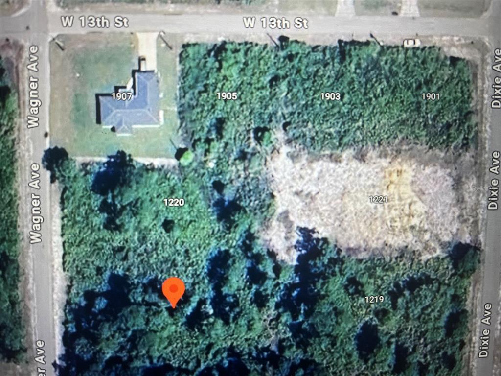 An aerial map view shows several wooded residential lots bordered by W 13th St and streets — 1218 WAGNER AVENUE, LEHIGH ACRES, FL
