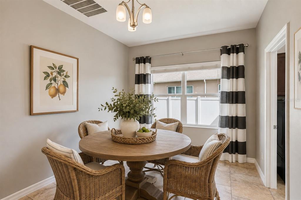 A screened-in patio features a kidney-shaped swimming pool and a paved deck area — 12604 HAMMOCK POINTE CIRCLE, CLERMONT, FL