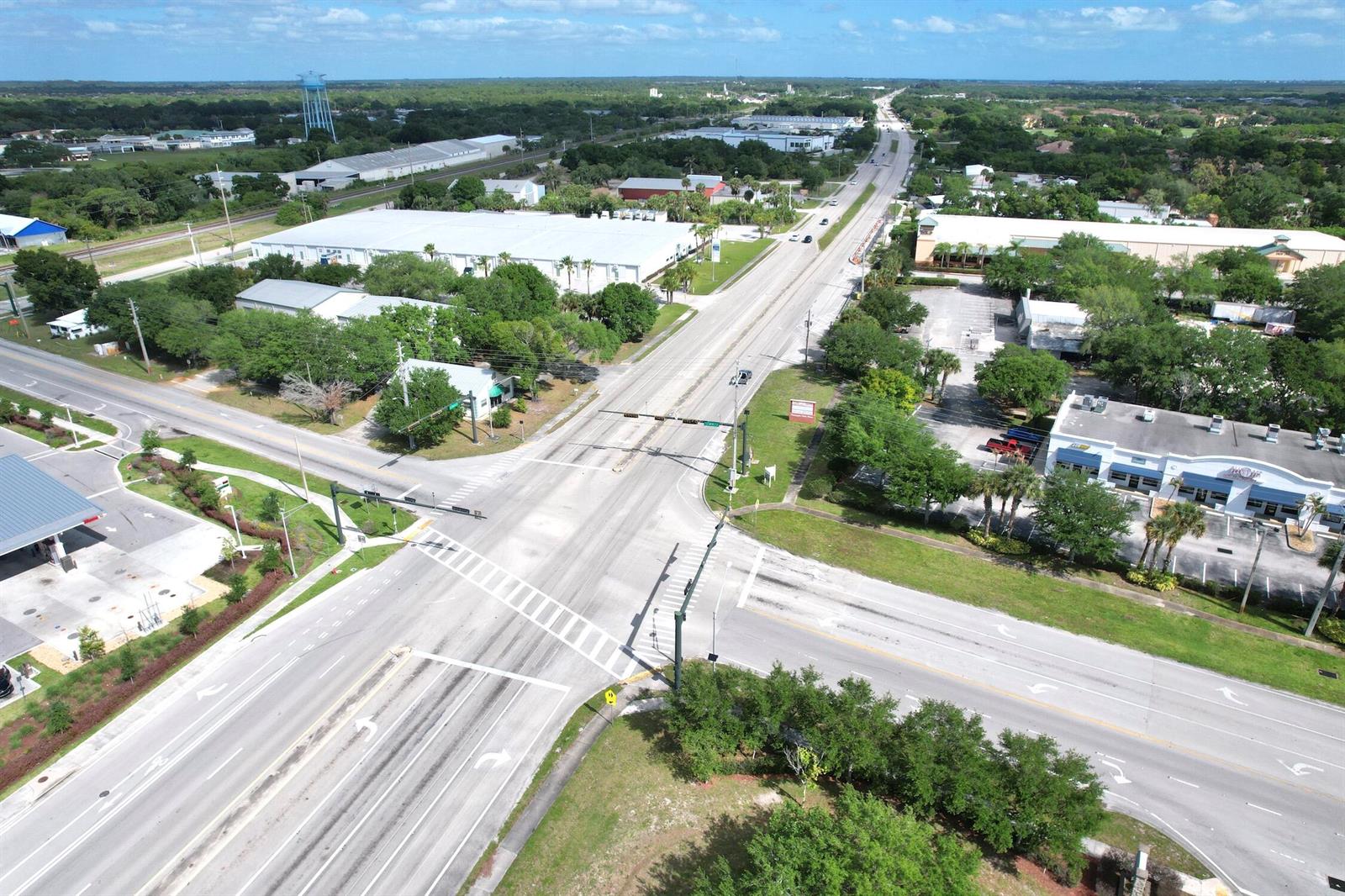 An aerial view of a commercial intersection with surrounding industrial buildings and green space — 4505 Us Highway 1 Highway, Vero Beach FL 32967, VERO BEACH, FL