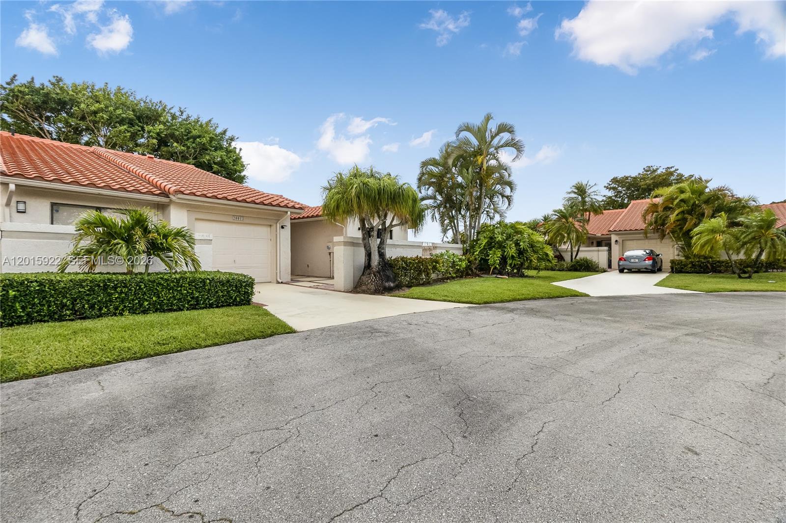 A street view shows two single-story houses with tile roofs, driveways, and tropical landscaping — 20013 Mona Cir, Boca Raton FL 33434, BOCA RATON, FL