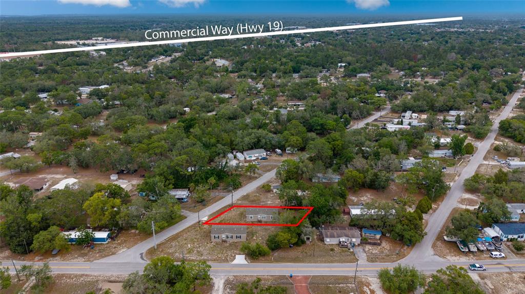 An aerial view shows a residential property outlined in red near a main road — 3264 STEPHENS BOULEVARD, SPRING HILL, FL
