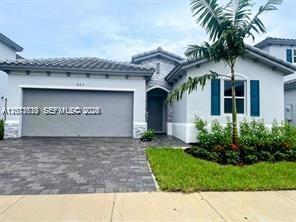 A single-story house with a gray garage, blue shutters, and a palm tree in front — 863 SE 26th Ter # 0, Homestead FL 33035, HOMESTEAD, FL