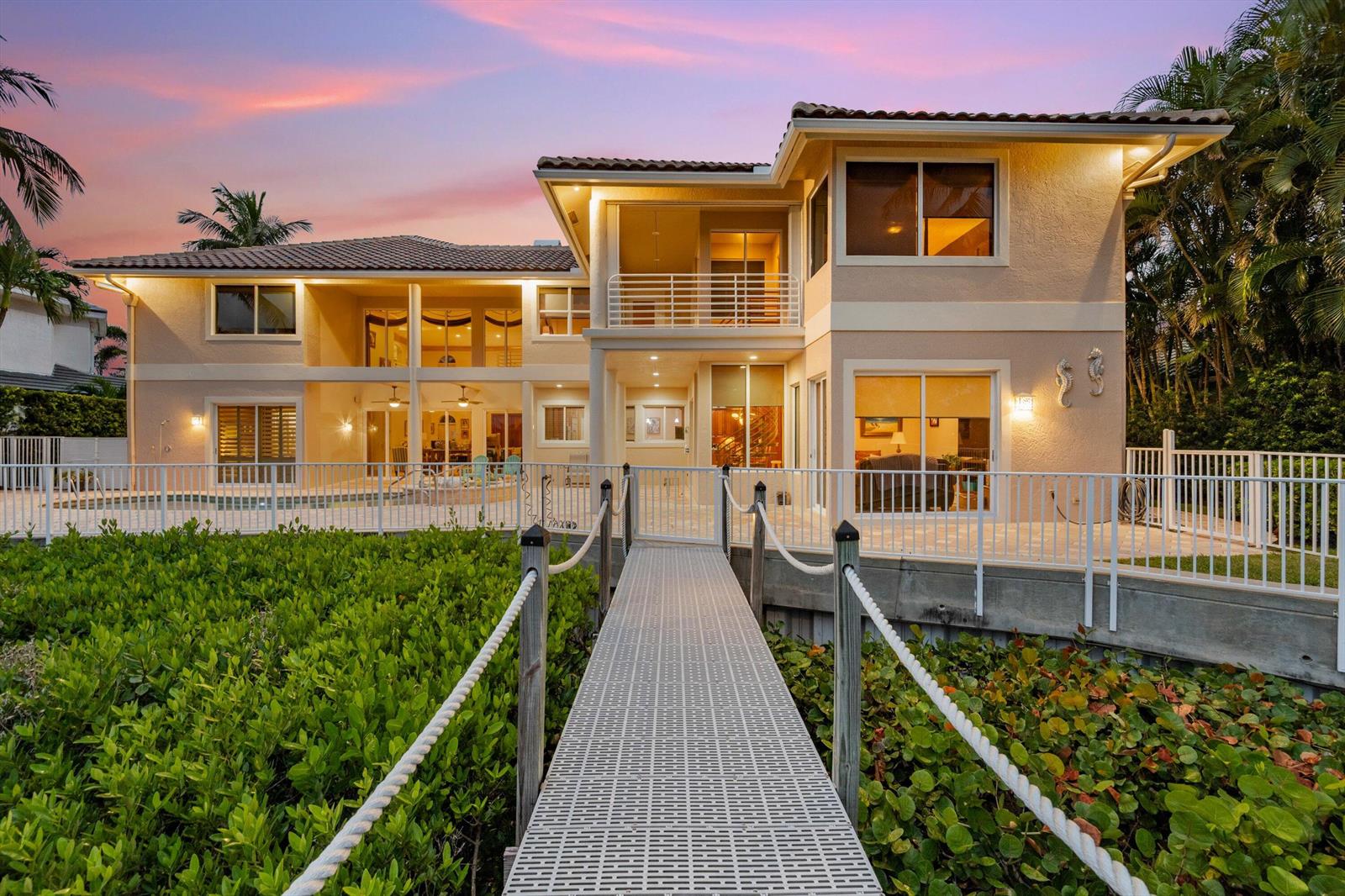 A two-story house with a pool deck and a walkway leading to the entrance — 3164 Casseekey Island Road, Jupiter FL 33477, JUPITER, FL