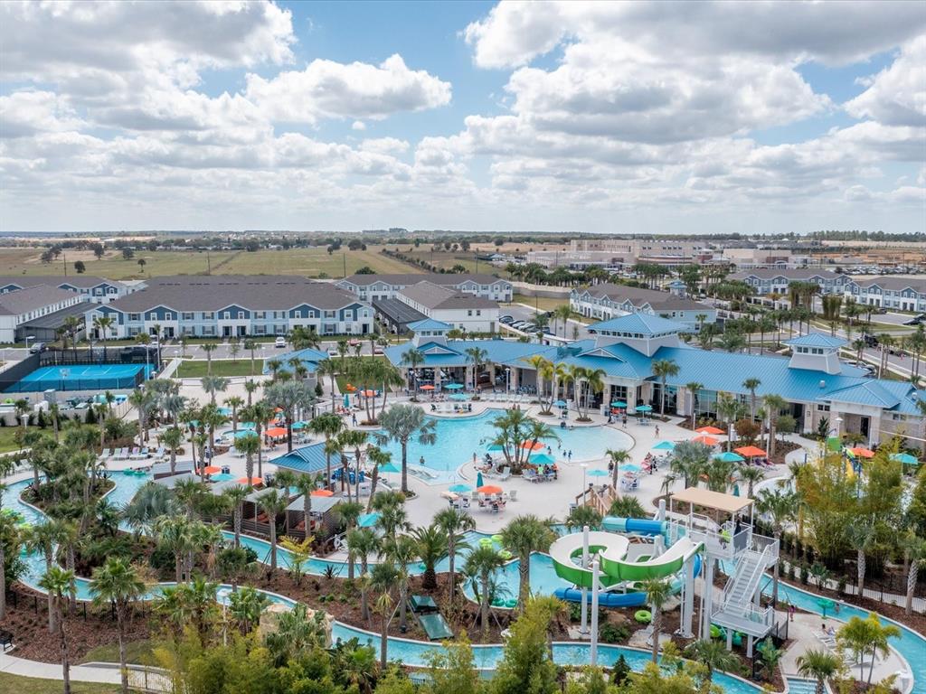 An aerial view of a resort pool complex with a lazy river and water slides — 3044 MAHALO DRIVE, DAVENPORT, FL
