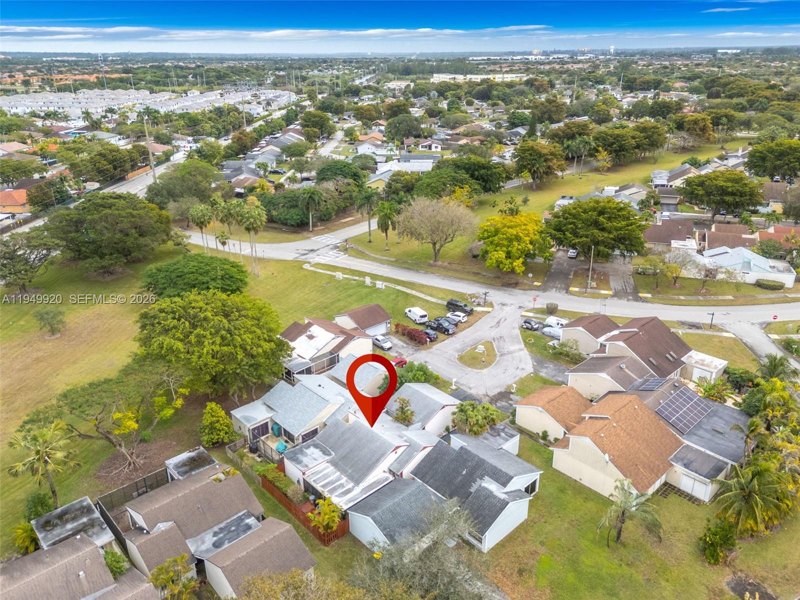 An aerial view shows a residential neighborhood with a red location pin over a house — 1304 Redstart Ct, Homestead FL 33035, HOMESTEAD, FL