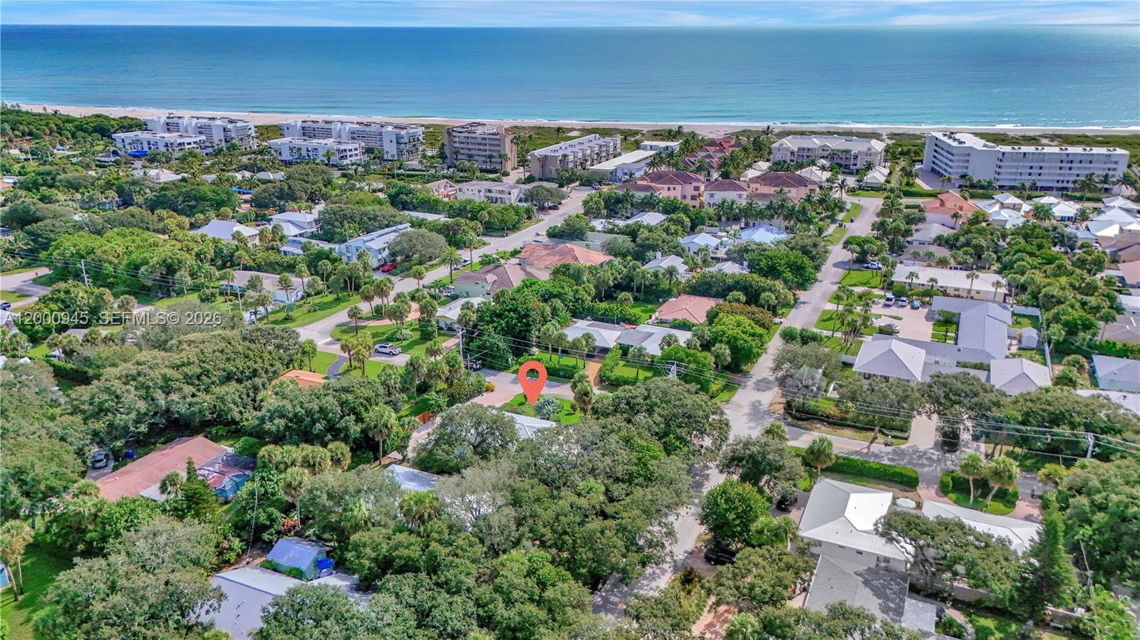 An aerial view shows a residential neighborhood with a red location pin on a house — 1505 Coral Ave, Vero Beach FL 32963, VERO BEACH, FL