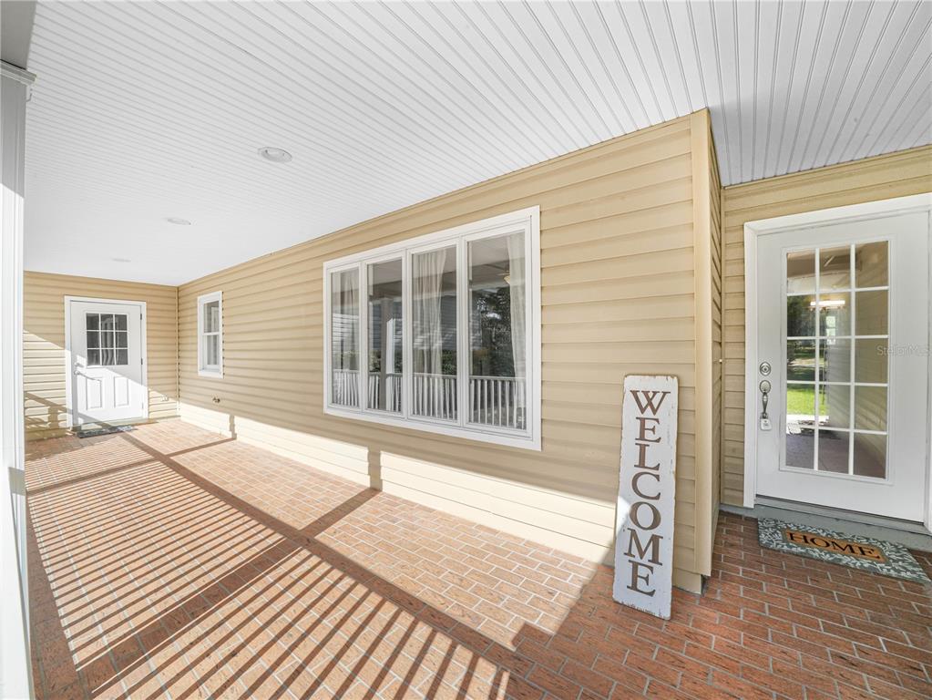 A dirt driveway winds through a grassy field lined with trees and wire fencing — 3963 MAMMOTH GROVE ROAD, LAKE WALES, FL