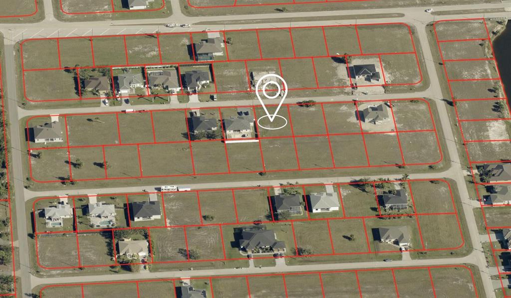 This aerial map shows a residential neighborhood with outlined property lots and a location pin — 3940 NW 41ST AVENUE, CAPE CORAL, FL
