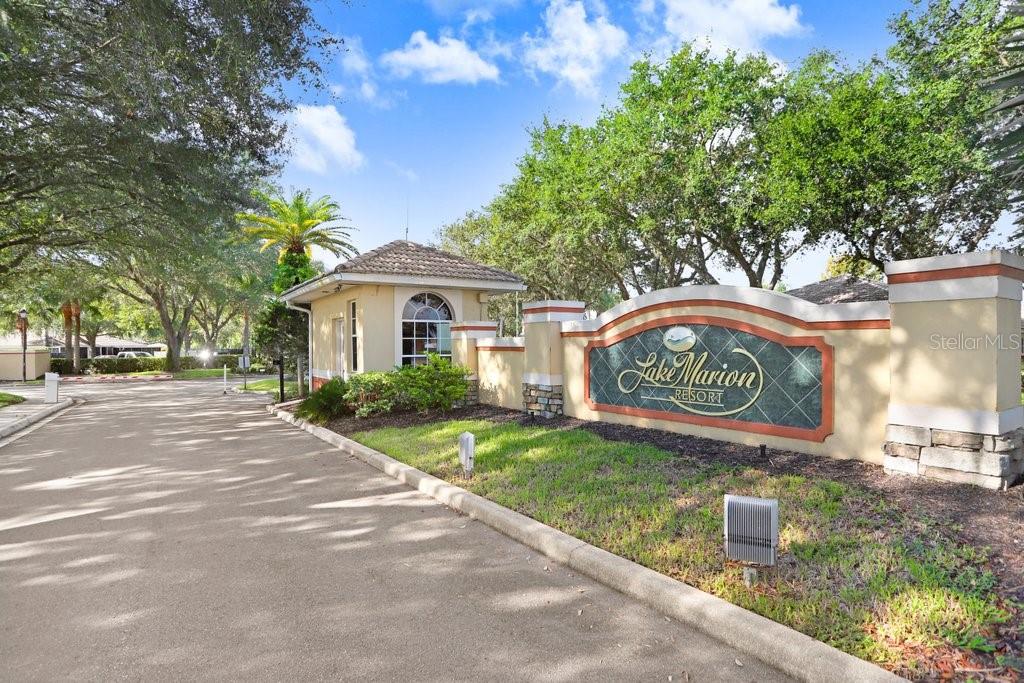The entrance to Lake Marion Resort features a gated guardhouse and a stone monument sign — 116 OCEAN BLUFF DRIVE, KISSIMMEE, FL