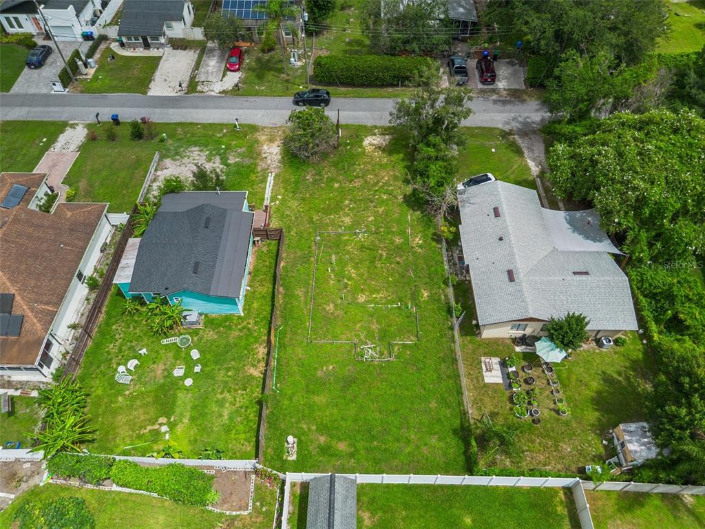 An aerial view shows a vacant residential lot situated between two existing houses — 10130 FRANKEL STREET, ORLANDO, FL
