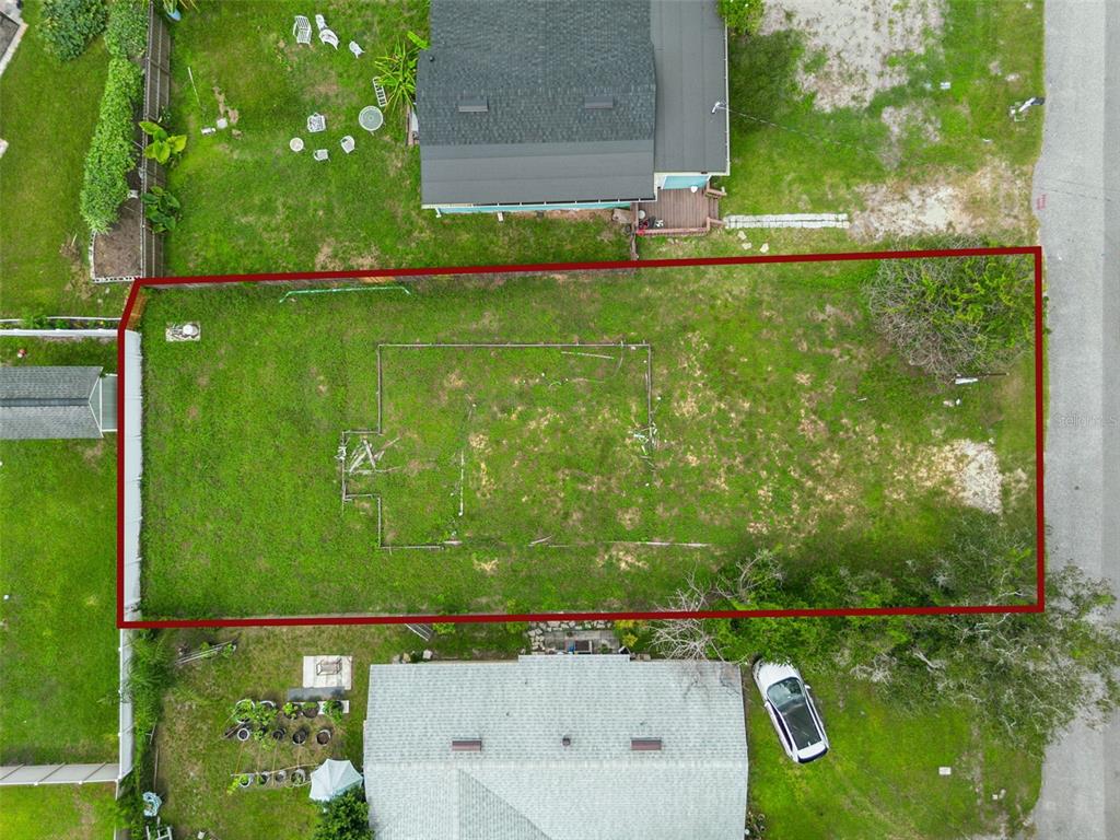 An aerial view shows a rectangular vacant lot outlined in red between two residential houses — 10130 FRANKEL STREET, ORLANDO, FL