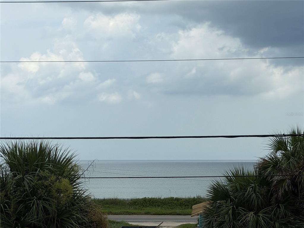 An aerial view of a beachfront house with a swimming pool and a sun shade — 2446 S CENTRAL AVENUE, FLAGLER BEACH, FL