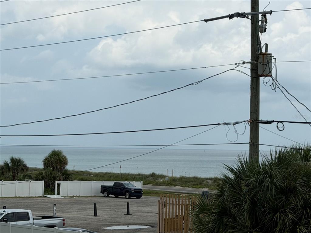 An aerial view of a beachfront house with a swimming pool and a shade sail — 2446 S CENTRAL AVENUE, FLAGLER BEACH, FL