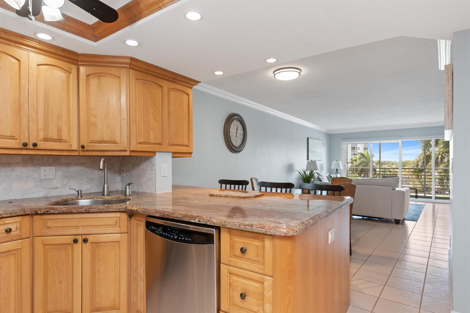 A kitchen with light wood cabinets, granite countertops, and a stainless steel dishwasher — 2731 NE 14th St Causeway # 532, Pompano Beach FL 33062, POMPANO BEACH, FL