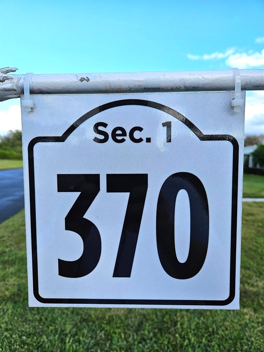 A white sign with the text "Sec. 1" and the number "370" hangs from a metal pole — 370 High Point Boulevard # C, Delray Beach FL 33445, DELRAY BEACH, FL