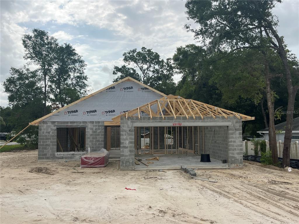 This floor plan shows a three-bedroom, two-bathroom house with a two-car garage and covered patio — 16253 SE 83RD COURT, SUMMERFIELD, FL
