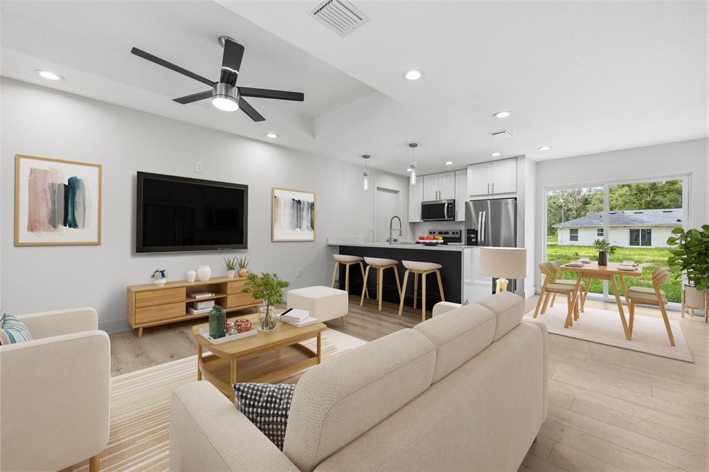 This is a digital rendering of an open-concept living room and kitchen with modern finishes — 9599 W SANDRA STREET, CRYSTAL RIVER, FL