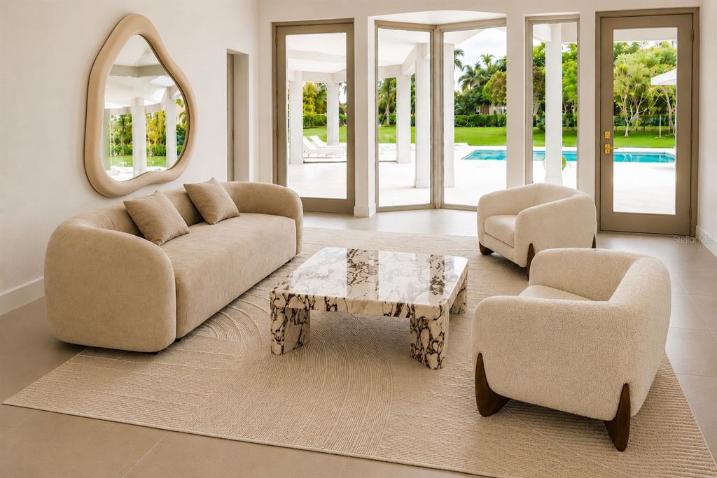 A living room features a beige sofa, two armchairs, a marble coffee table, and pool views — 23710 SW 214TH PLACE, HOMESTEAD, FL