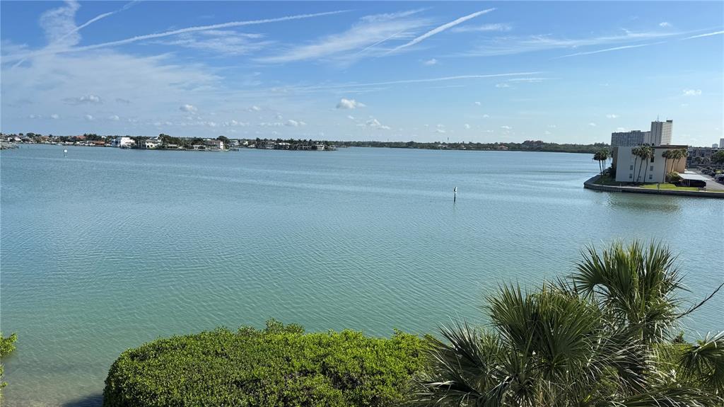 A view of a calm bay with distant houses and a building on the right — 7979 SAILBOAT KEY BOULEVARD S UNIT 306, SOUTH PASADENA, FL