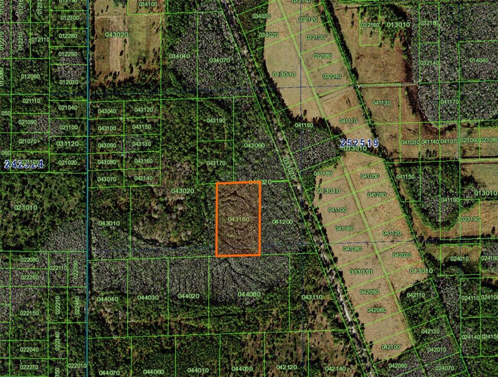 This is a satellite map showing property parcel boundaries with one lot highlighted in orange — 0, POLK CITY, FL