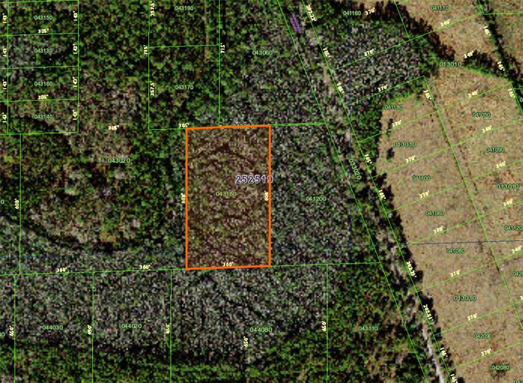 This is a satellite map showing a rectangular property parcel outlined in orange — 0, POLK CITY, FL