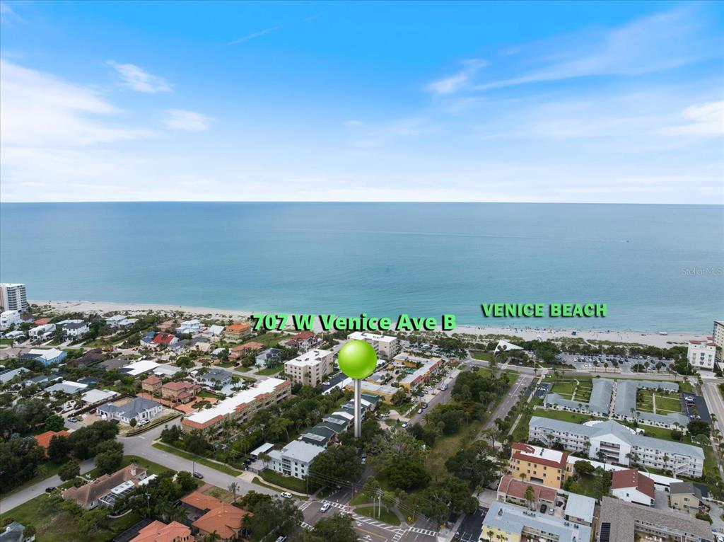 An aerial view shows a coastal neighborhood with a green location marker near the beach — 707 W VENICE AVENUE UNIT 707B, VENICE, FL